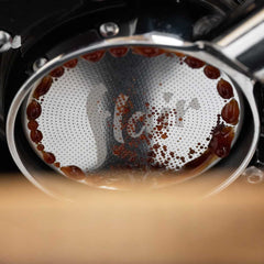 Flair 58 High Uniformity Portafilter Basket from underneath a group head with first drops
