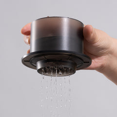 Timemore SimpleDrip Pour-Over Tool in hand with shower