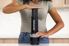 AeroPress XL being used by woman on counter
