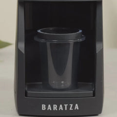 Black Baratza Encore ESP Pro electric coffee grinder dosing cup in grind tray