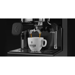 Gaggia Classic UP pouring espresso from a double-spout portafilter into a white Gaggia cup.