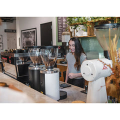 Black & white Mahlkönig E80W GbS grinders on a café bar