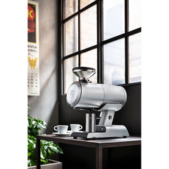 Mazzer Philos Silver single dose espresso grinder with dosing cup on café bar