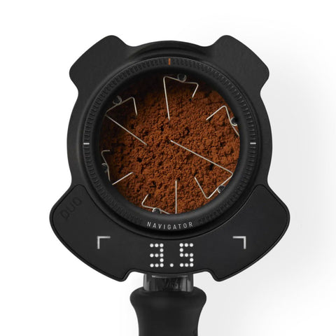 Puq Navigator WDT tool on portafilter with coffee grounds