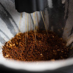 Nucleus Bloom needles close up in pour over bed of coffee