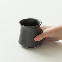 Black Origami Harmony Cup with hand