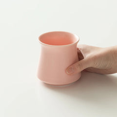 Pink Origami Harmony Cup with hand