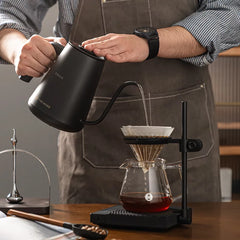 Barista pouring with the Timemore Fish Pro X gooseneck kettle over a pour-over brewer