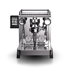 Rocket R58 TUNE espresso machine viewed from the front with portafilter fitted and touchscreen mounted on the left.