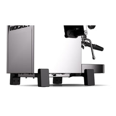 Low side view of the Rocket R58 TUNE espresso machine showing its black feet and polished stainless steel body.