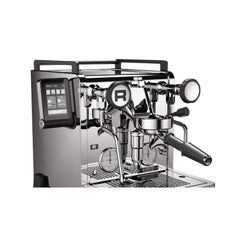 Angled close-up of the Rocket R58 TUNE espresso machine showing the touchscreen, group head and portafilter.