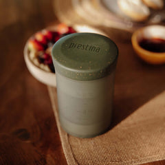 Assembled Sage Green Wacaco Prestina on a breakfast table beside a folded napkin.