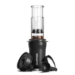 AeroPress Go Plus coffee press on tumbler with accessories 2