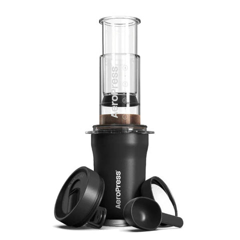 AeroPress Go Plus coffee press on tumbler with accessories