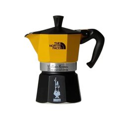 Yellow and black Bialetti x The North Face 3-cup Moka Express with co-branded logos.