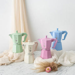 Bialetti Moka Colour Exclusive Colours 6 cup stovetop coffee makers on marble counter with curtains and dried flowers