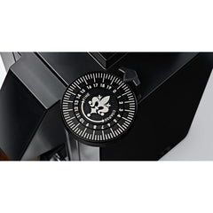 Top view of the Eureka Mignon King Size Dial installed on a black coffee grinder, showing the scale and pointer.