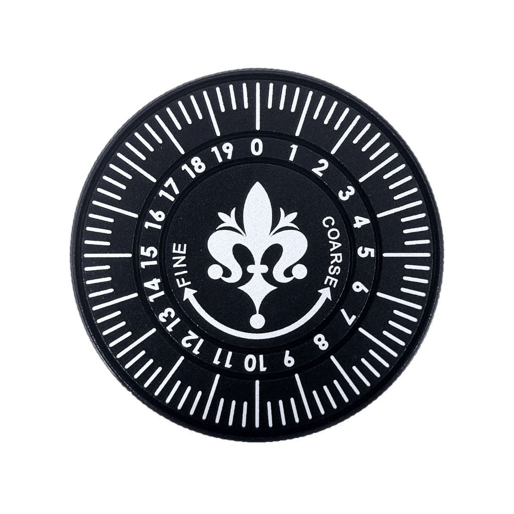 Black Eureka Mignon King Size Dial with numbered grind settings, white scale markings and fine-to-coarse arrows.