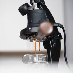 Flair 58+ manual espresso maker dripping espresso into coffee cup