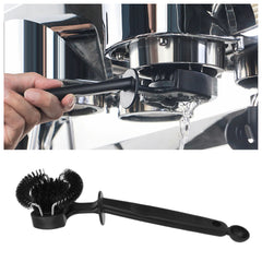 Group head cleaning brush in use cleaning an espresso machine