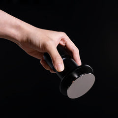 Timemore Impulse Impact spring loaded tamper held in a hand