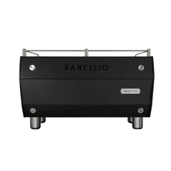 Rear view of the black Rancilio Invicta espresso machine showing Rancilio branding, Invicta badge and cup rail.