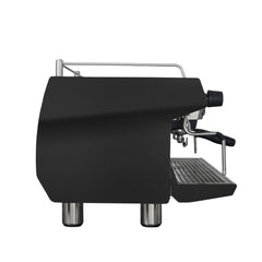 Side profile of the black Rancilio Invicta espresso machine showing its angular casing, cup rail and projecting drip tray.