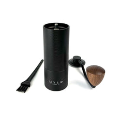 Mylo Coffee Company SG Mini hand grinder with top off and brush