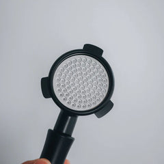 Normcore puck screen inside black portafilter