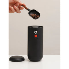 Nuttii OX Lite Portable Electric Grinder with coffee beans