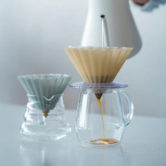 Origami drip coffee brewer in carafes