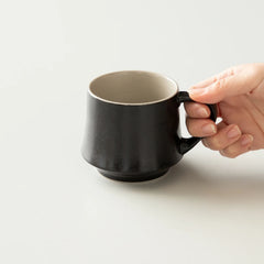 Vintage Black Origami Flare Mug with hand