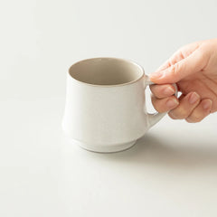 Vintage White Ash Origami Flare Mug with hand