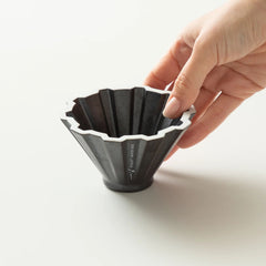Black Origami Pinn dripper with hand