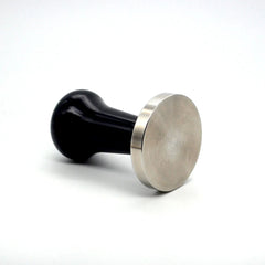 Precision 58.4mm black handle espresso tamper with stainless steel base on its side
