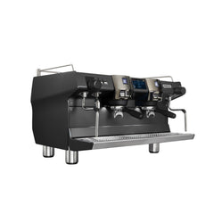 Three-quarter front view of the black Rancilio Invicta two-group espresso machine with portafilters, touchscreen and steam wands.