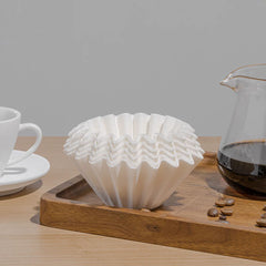 Timemore Basket B75 Filter Papers next to coffee carafe and cup