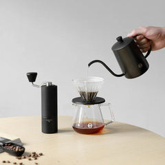 Image of coffee brewing with the Timemore C3s pourover set with coffee beans