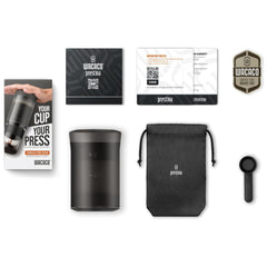 Wacaco Prestina coffee maker with carry pouch, scoop, instruction booklet, warranty paperwork and Wacaco sticker.