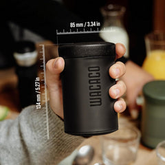 Wacaco Prestina held in one hand, with dimensions marked as 85 mm wide and 134 mm tall.
