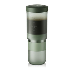 Wacaco Prestina in Sage Green with coffee in the brewing chamber above the attached cup.